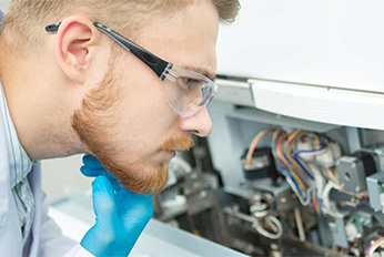Biomedical Clinical Technician student working on Equipment