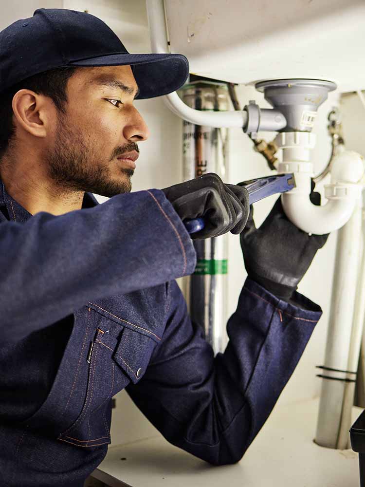 Plumbing Technology Student working on sink.
