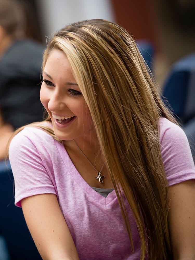 Woman smiling downard
