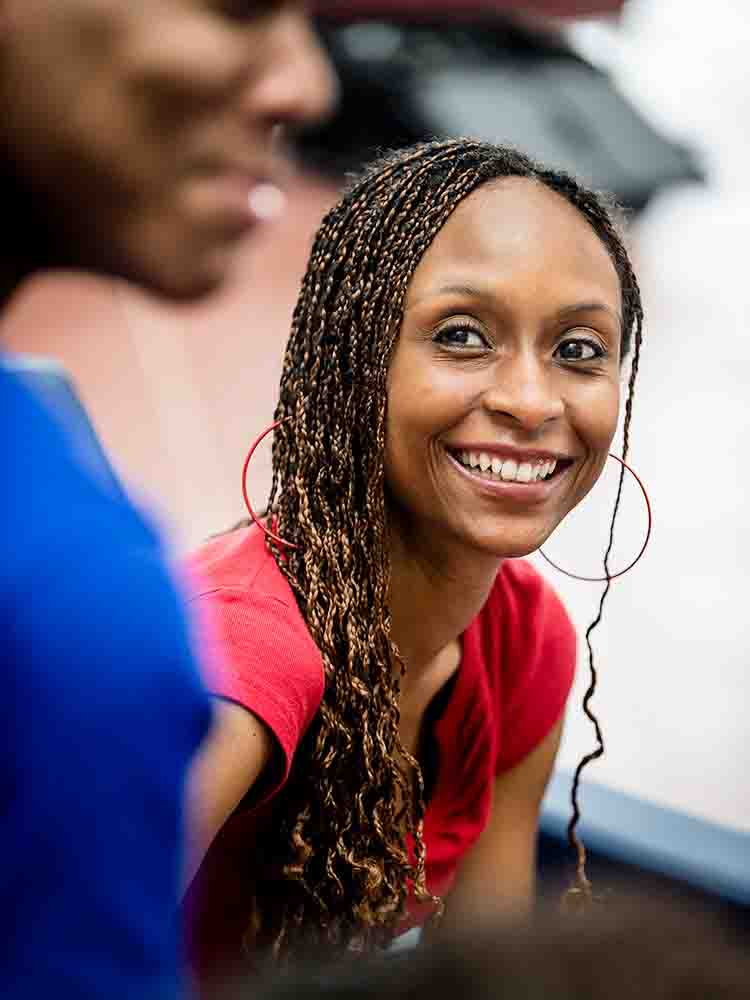 Woman smiling at man